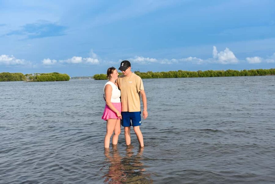 Negombo: Sunset lagoon boat tour with hotel transfers - Walking through the shallow lagoon